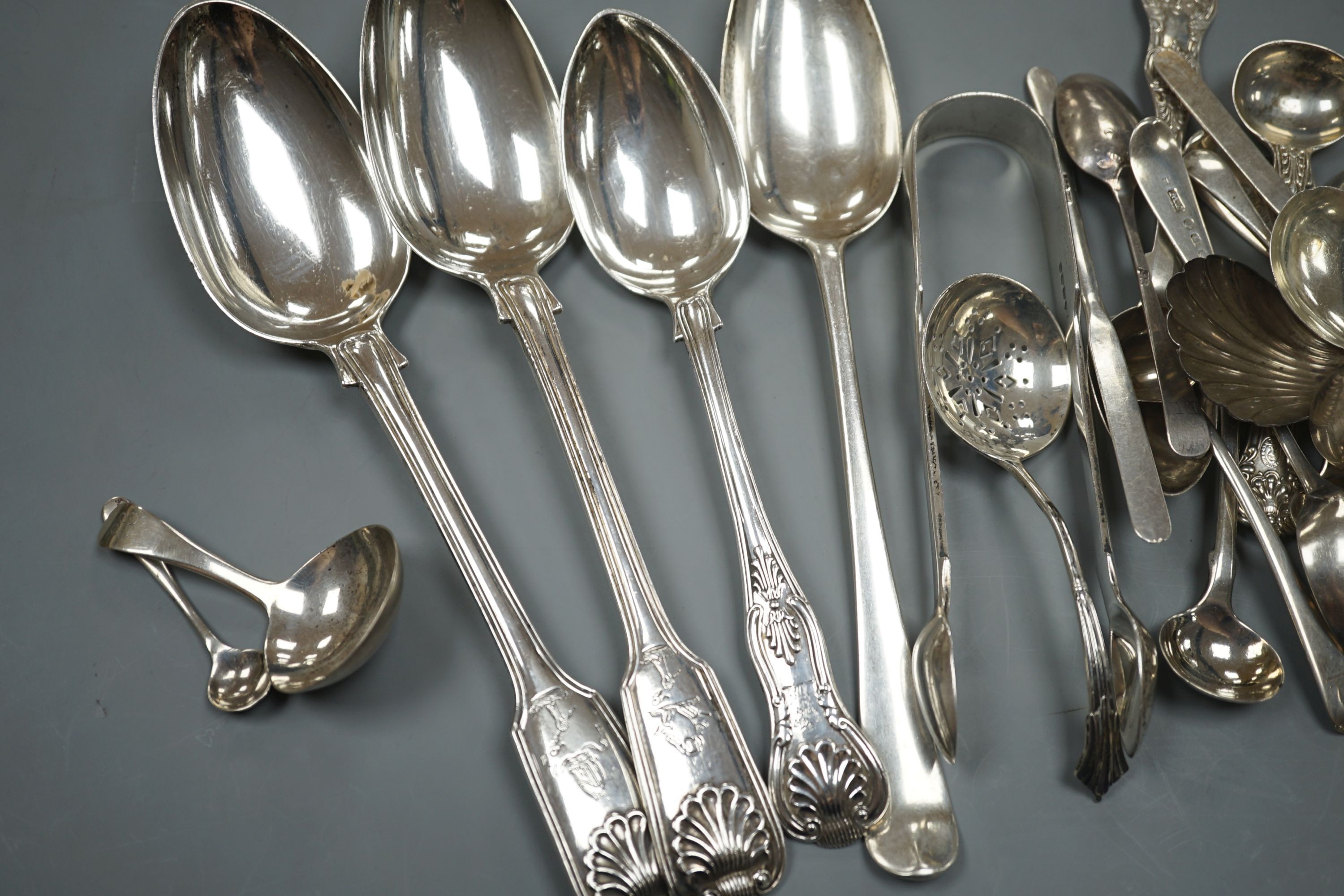 A quantity of assorted mainly 19th century and later flatware, including two Georgian caddy spoons, Victorian tablespoons, an 18th century tablespoon and assorted condiment spoons, various dates and maker's